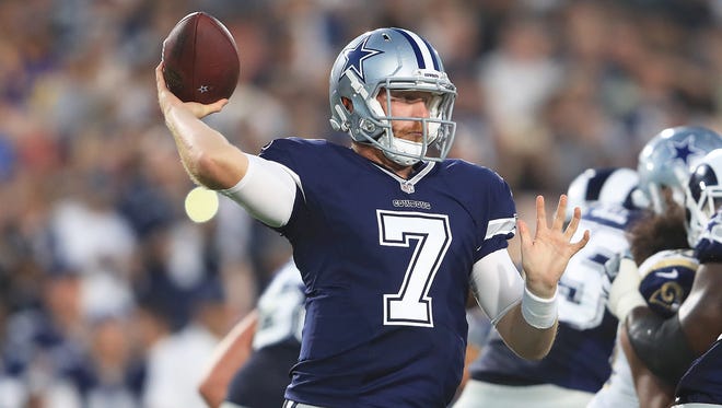 Cooper Rush #7 of the Dallas Cowboys throws a pass during the preseason game against the Los Angeles Rams at the Los Angeles Memorial Coliseum on August 12, 2017 in Los Angeles, California.