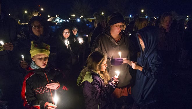 A candlelight vigil was held at a park in Aztec, New Mexico at 6 pm, Thursday, December 7, 2017, after three people were shot to death at the local high school.