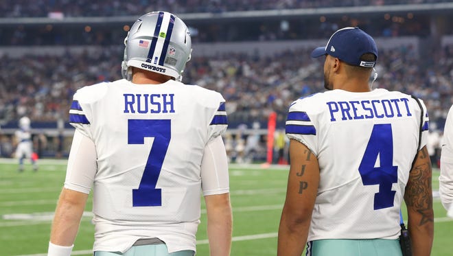 Dallas Cowboys quarterback Dak Prescott (4) with quarterback Cooper Rush (7) on the sidelines during the game against Indianapolis Colts at AT&T Stadium.