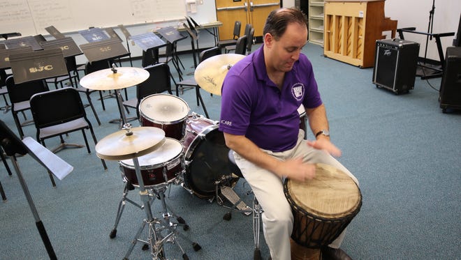 San Juan College music professor Teun Fetz plays a djembe, one of the instruments that will be featured when the college's African Drumming Ensemble performs this weekend.
