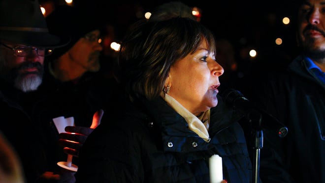 Gov. Susana Martinez speaks Thursday during a candlelight vigil for Aztec High School shooting victims at Minium Park in Aztec.