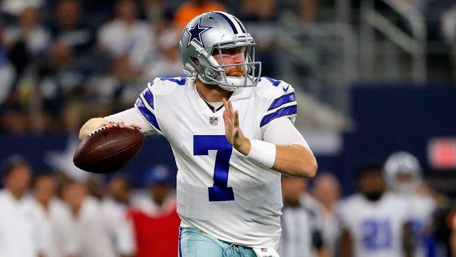 Dallas Cowboys quarterback Cooper Rush (7) prepares to throw a pass in the second half of a preseason NFL football game against the Indianapolis Colts on Saturday, Aug. 19, 2017, in Arlington, Texas.