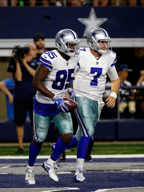 Dallas Cowboys wide receiver Noah Brown (85) and quarterback Cooper Rush (7) celebrate a touchdown during a preseason NFL football game against the Indianapolis Colts on Saturday, Aug. 19, 2017, in Arlington, Texas.