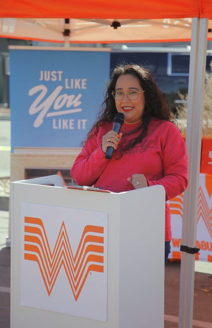 Zuri Soto, the director of operational support, greets the crowd during an event introducing a planned Whataburger restaurant on East Main Street in Farmington on Tuesday, March 12.