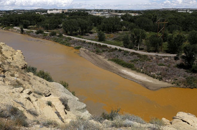 Water from the Animas River mixes with the San Juan River on Aug. 8, 2015, shortly after the Gold King Mine spill.
