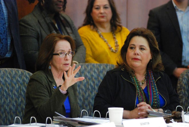 New Mexico lawmakers including state Sen. Mimi Stewart, D-Albuquerque, left, and Rep. Patria Lundstrom, D-Gallup, announce a proposal in this file photo from Jan. 14, 2019, in Santa Fe, N.M. Stewart chairs the Legislative Education Study Committee, which recently backed proposed legislation that would require public schools to increase the amount of time all students spend learning next school year. The idea is to address learning loss that has resulted from the pandemic.