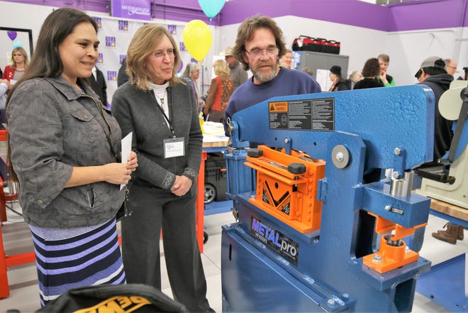 In this file photo, Shannon Teseny, left, San Juan College adjunct instructor Tammy Schreiner, middle, and Fred Byrd examine equipment in the The Big Idea @ SJC makerspace in the San Juan College Quality Center for Business. New grant money will fund new entrepreneurship programs at the center.