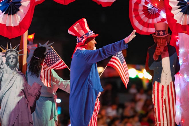 Floats ride down the street at the annual Las Cruces Electric Light Parade near Apodaca Park on Wednesday, June 3, 2019.