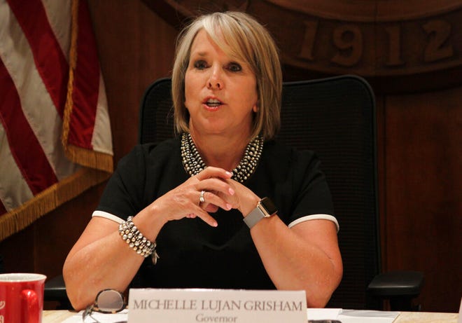 In this July 9, 2019 file photo, New Mexico Gov. Michelle Lujan Grisham provides a progress report on her first six months in office during a news conference in Santa Fe. The governor announced Tuesday, Aug. 6, 2019, that she will ask lawmakers to consider reforming the state Public Regulation Commission.