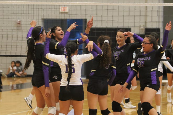 Kirtland Central celebrates winning a point against Navajo Prep during a volleyball match on Thursday, Aug. 22, 2019 at the Eagles Nest in Farmington.