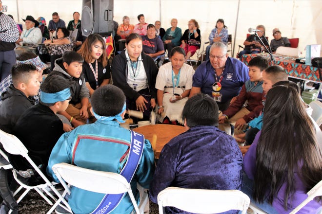Tsé Bit’a’í Middle School heritage language teacher Elvin Keeswood leads a student drum circle, Thursday, Oct. 3, 2019, during the 108th Northern Navajo Nation Fair in Shiprock.