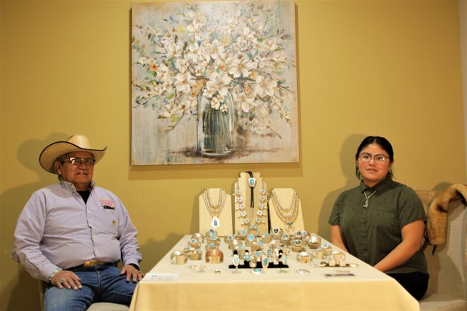 JP Arviso, left, and his daughter, Devon Chee-Arviso, right, owners of Western Custom Engraving, display their handmade turquoise jewelry in the offices of R1 New Mexico in Farmington on Main Street on Nov. 30, 2019, Small Business Saturday.