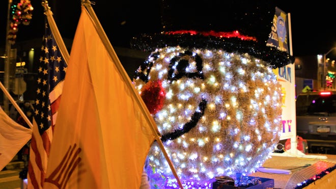 A huge snowman head was part of Farmington ' s annual Christmas Parade downtown on Dec. 5, 2019.