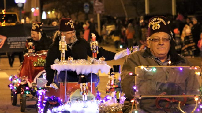 San Juan Shrine Club members rolled along in decorated vehicles during Farmington ' s annual Christmas Parade on Dec. 5, 2019.