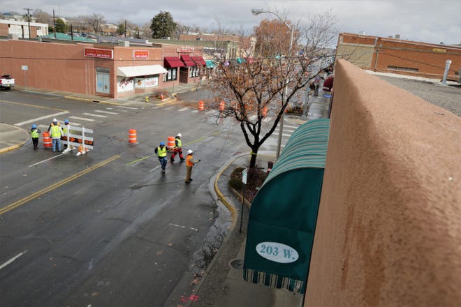 With several blocks of Main Street through downtown Farmington closed to traffic, city workers prepare to remove trees from the intersection at Allen Avenue on Dec. 27, 2019.