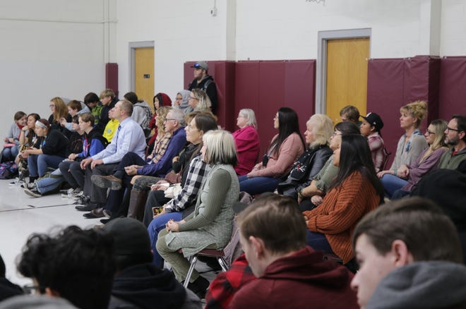Students, faculty members and visitors listen as Rodney Barker speaks during an assembly Jan. 10, 2020, at Rocinante High School in Farmington.