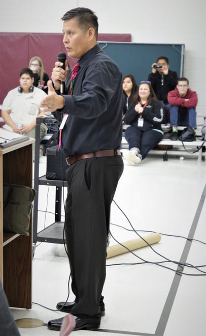 Rocinante HIgh School Principal Peter Deswood addresses students at the beginning of an assembly at the school featuring author Rodney Barker on Jan. 10, 2020.