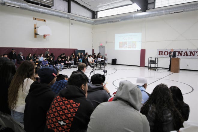 Author Rodney Parker, right, addresses students at Rocinante High School in Farmington on Jan. 10, 2020, about the lingering impact of his book "The Broken Circle."