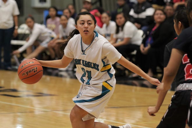 Navajo Prep's Holly Walker moves the ball against Crownpoint during Wednesday's District 1-3A girls basketball tournament semifinals game at the Eagles Nest in Farmington.