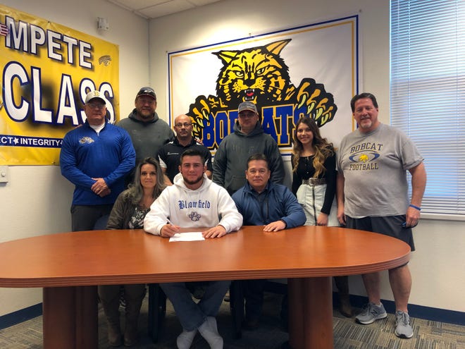 Bloomfield quarterback Vince Marquez signs his national letter of intent on Thursday to continue his football career at NAIA’s Arizona Christian University.