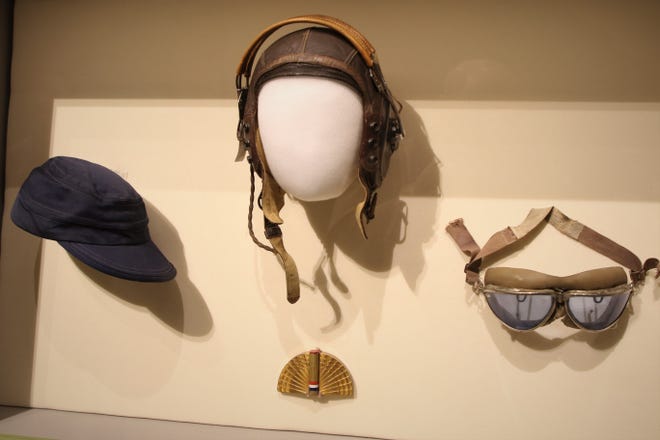 A WASP flight uniform cap, leather helmet with earphones, goggles and compact with rouge, powder and lipstick are part of a display on World War II women's fashion included in the "Inside Out" show at the Farmignton Museum at Gateway Park.