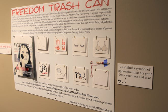 A display at the "Inside Out" exhibition at the Farmington Museum at Gateway Park encourages visitors to choose an "instrument of torture" symbol and dispose of it in the Freedom Trash Can.