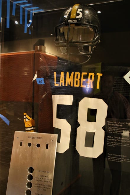 A Jack Lambert jersey and a Mean Joe Green helmet are included in a Pittsburgh Steelers display in the "Gridiron Glory" exhibition at the Farmington Museum at Gateway Park.