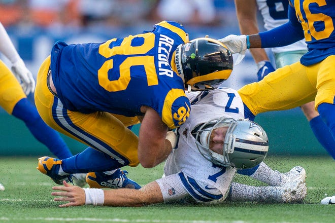 August 17, 2019;  Honolulu, HI, USA; Los Angeles Rams linebacker Troy Reeder (95) commits an illegal hit on Dallas Cowboys quarterback Cooper Rush (7) during the third quarter at Aloha Stadium.