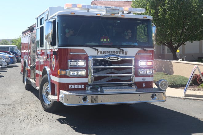 Members of the Farmington Fire Department take part in the Parking Lot Love Parade on May 13, 2020, at The Bridge at Farmington assisted living center.