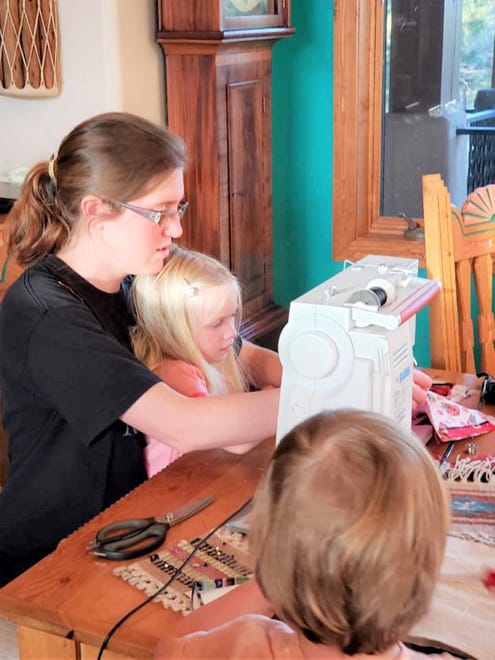 Kirby Ann Witte Taggart and her daughter sew masks together for "Project Facemask." Its efforts has produced hundreds of masks that have been distributed throughout the community since the urgent need for PPEs began in March, 2020.
