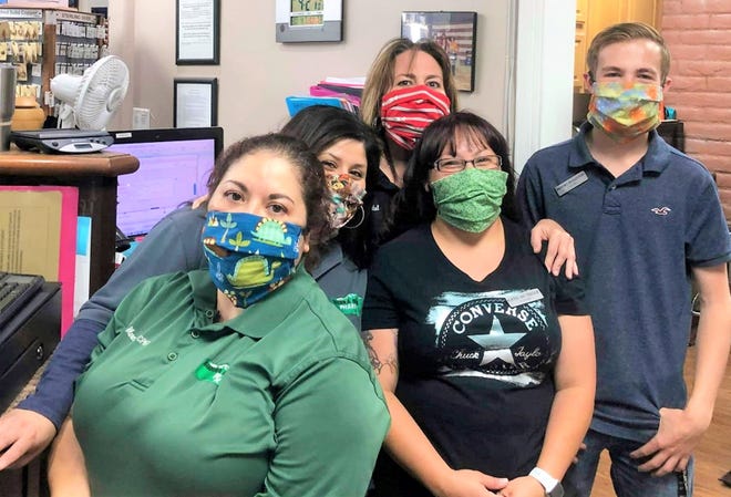 Staff at Sierra Blanca Pharmacy take time out of their busy schedules for a picture with their masks made by Project Facemask. From left are: Resa Mercado, Betsy Begay, Kassi Mcteigue, Micha Woodul and Brooks Egglestontouse.