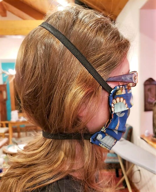 Kirby Ann Witte Taggart demonstrated how the masks should be worn for proper protection. "Project Facemask" was organized as the need for PPEs grew in Ruidoso since March, 2020.