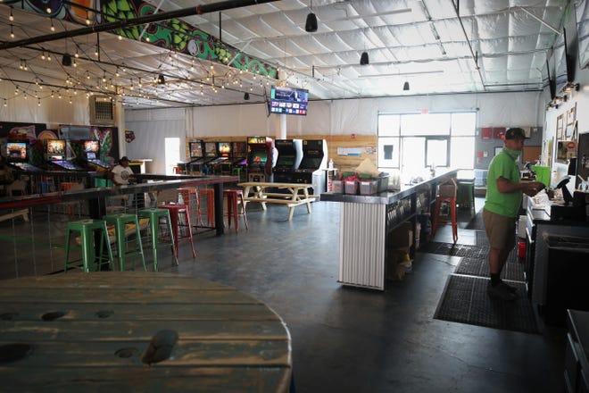 The Lauter Haus Brewing Co. in Farmington is welcoming customers back inside, but its owner says many people appear reluctant to begin socializing again as fears of COVID-19 linger.