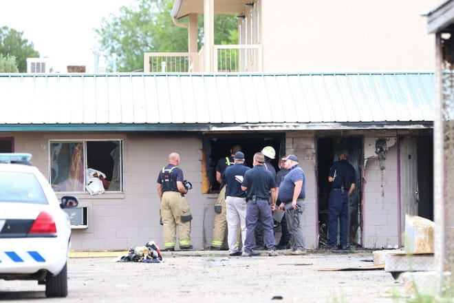 The Farmington Fire Department investigate a blaze at the Sage Motel at the intersection of Glade Lane and Airport Drive on July 23.