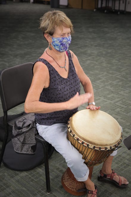 Student Laura Ryan keeps the beat during an African drumming class at San Juan College on Aug. 24, 2020.