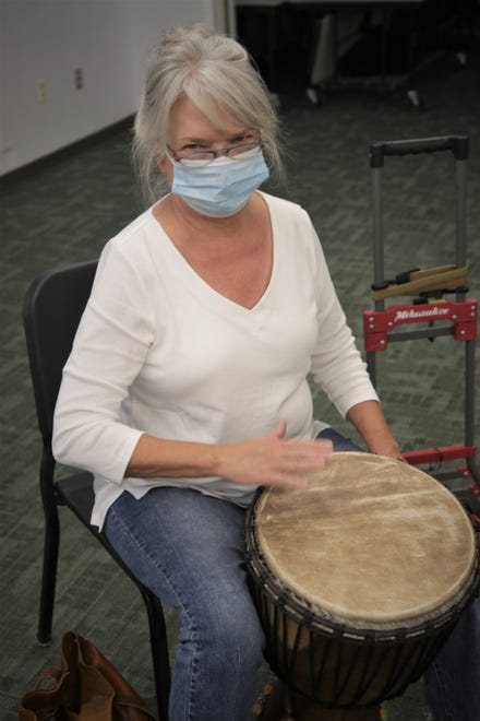 Student Cheri Johnson concentrates on her rhythm during an African drumming class on Aug. 24, 2020, on the San Juan College campus in Farmington.