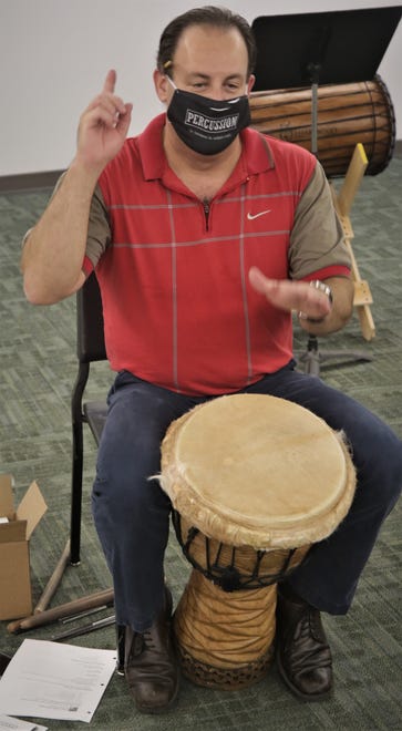 Instructor Teun Fetz signals to his students during an African drumming class on Aug. 24, 2020, on the San Juan College campus in Farmington.