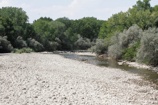 The Animas River, which has been running a 7 % of its normal flow, is pictured, Thursday, Aug. 27, 2020, in Farmington.