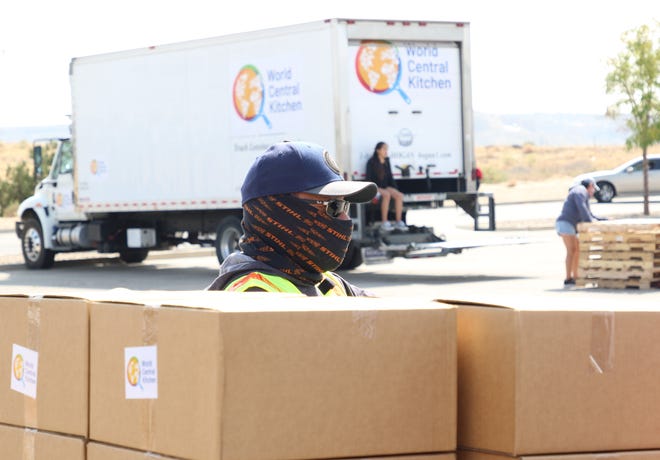 Navajo Nation Vice President Myron Lizer waits to load boxes of food during a distribution that coincided with a census event at Northern Edge Casino in Upper Fruitland.