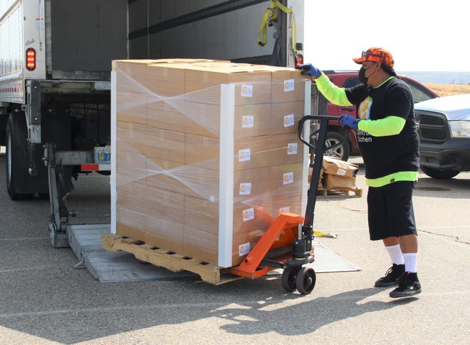 World Central Kitchen Driver Duane Platero unloads boxes of food on Sept. 19. The Navajo Nation president's office distributed food and other supplies during the 2020 Census event at Northern Edge Casino in Upper Fruitland.