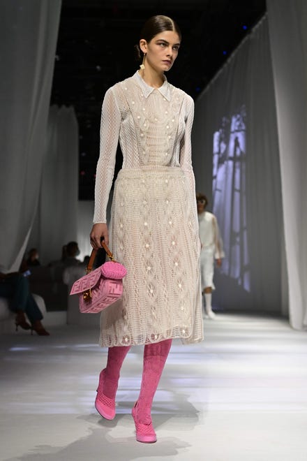 A model is accented by pink at the Fendi show.