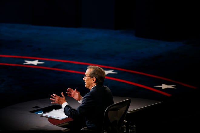 Chris Wallace of Fox News Sunday moderates the debate between President Donald Trump and Democratic presidential candidate, former Vice President Joe Biden in their first Presidential debate in the Sheila and Eric Samson Pavilion at the Cleveland Clinic, Tuesday, Sept. 29, 2020, in Cleveland.