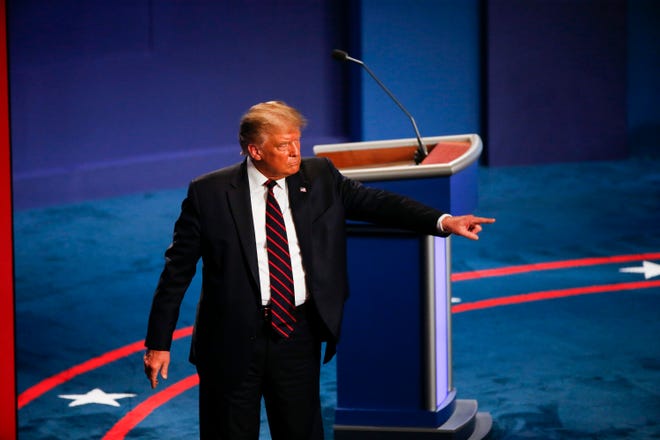 President Donald Trump leaves the stage after debating Democratic presidential candidate, former Vice President Joe Biden in the first Presidential debate in the Sheila and Eric Samson Pavilion at the Cleveland Clinic, Tuesday, Sept. 29, 2020, in Cleveland.