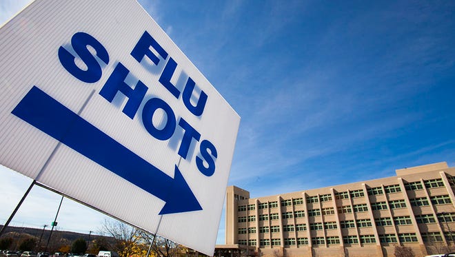 A sign directs drivers to a drive-thru flu shot clinic at San Juan Regional Medical Center last year. The hospital will be offering the clinics again this year on Oct. 24 and Oct. 31.