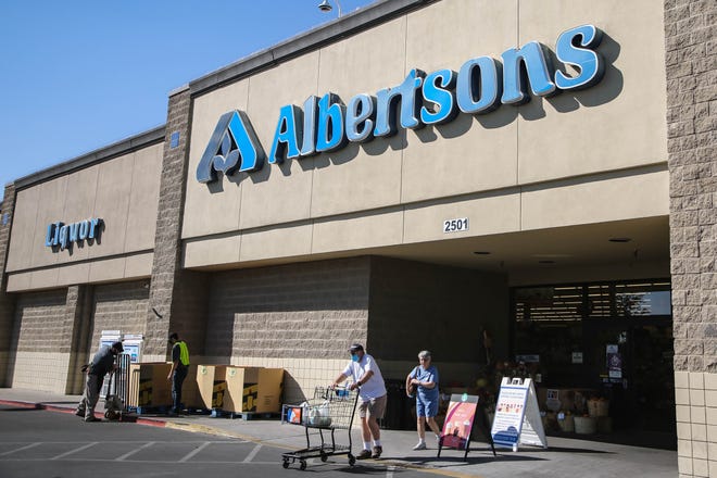Customers walk in and out of Albertsons, 2501 Main St., in Las Cruces. on Tuesday, Oct. 20, 2020. The New Mexico Environment Department published a rapid response COVID-19 watchlist on Tuesday and Albertsons on North Main is on it.