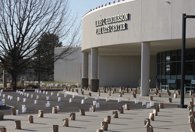 Luminaria bags are set out in front of the Henderson Fine Arts Center at San Juan College.