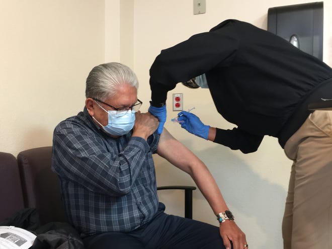 Navajo Nation Council Delegate Edison Wauneka receives the Pfizer-BioNTech COVID-19 vaccine on Dec. 31, 2020 at Gallup Indian Medical Center in Gallup.