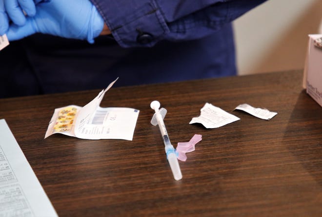 A syringe containing the Pfizer-BioNTech COVID-19 vaccine is seen on Dec. 31, 2020 at Gallup Indian Medical Center in Gallup.