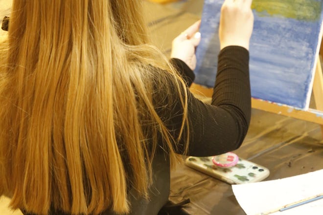 Mackenzie Terry practices a technique for blending brushstrokes during a class on Dec. 29, 2020, at Inspire heART at the Aztec Theater.