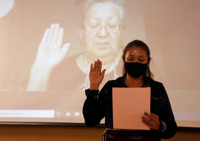 Lisa Marie Byrd takes the oath of office to serve as vice president for Upper Fruitland Chapter on Jan. 6 during the virtual Navajo Nation chapter government inauguration. In the background is Navajo Nation Supreme Court Associate Justice Eleanor Shirley who administered the oath from Window Rock, Arizona.